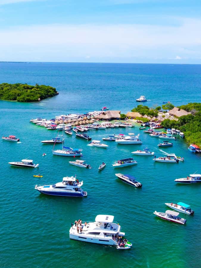 Cartagena: 4 Island Day Trip by Boat and Caribbean Lunch - Cholón and the sea-bath stop: party energy with crowd reality