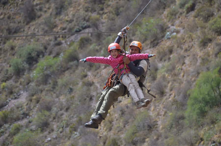 From Cusco: Half-Day Zip Line Adventure - Entering the Racchi launch area and reading the views